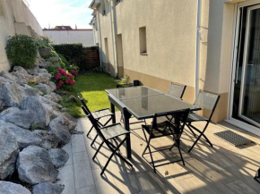 Appartement Spacieux proche digue avec jardin